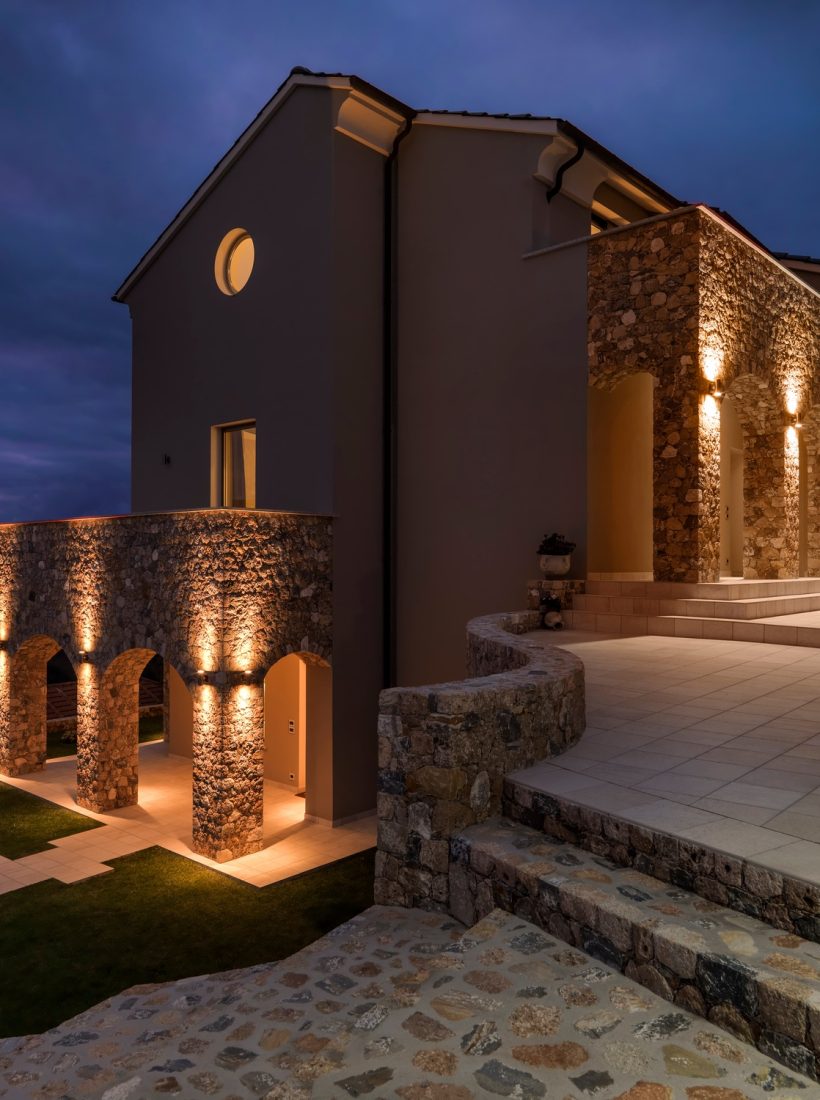 external shot of a modern villa by night